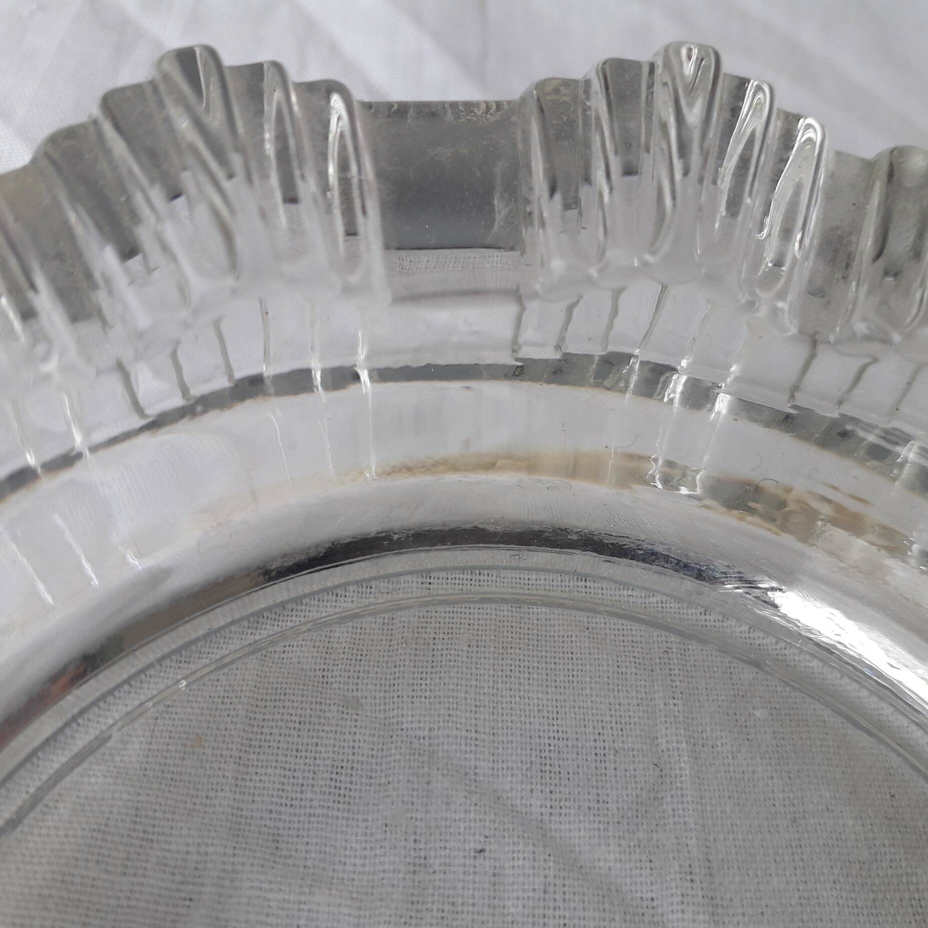 Ashtray or glass catchall.