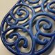 Old cast iron table mat