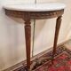 Console demie lune de style Louis XVI en bois sculpté