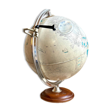 Tecnodidattica illuminated world map with magnifying glass