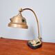 Art Nouveau desk lamp in brass on a black marble base, 1910-20.