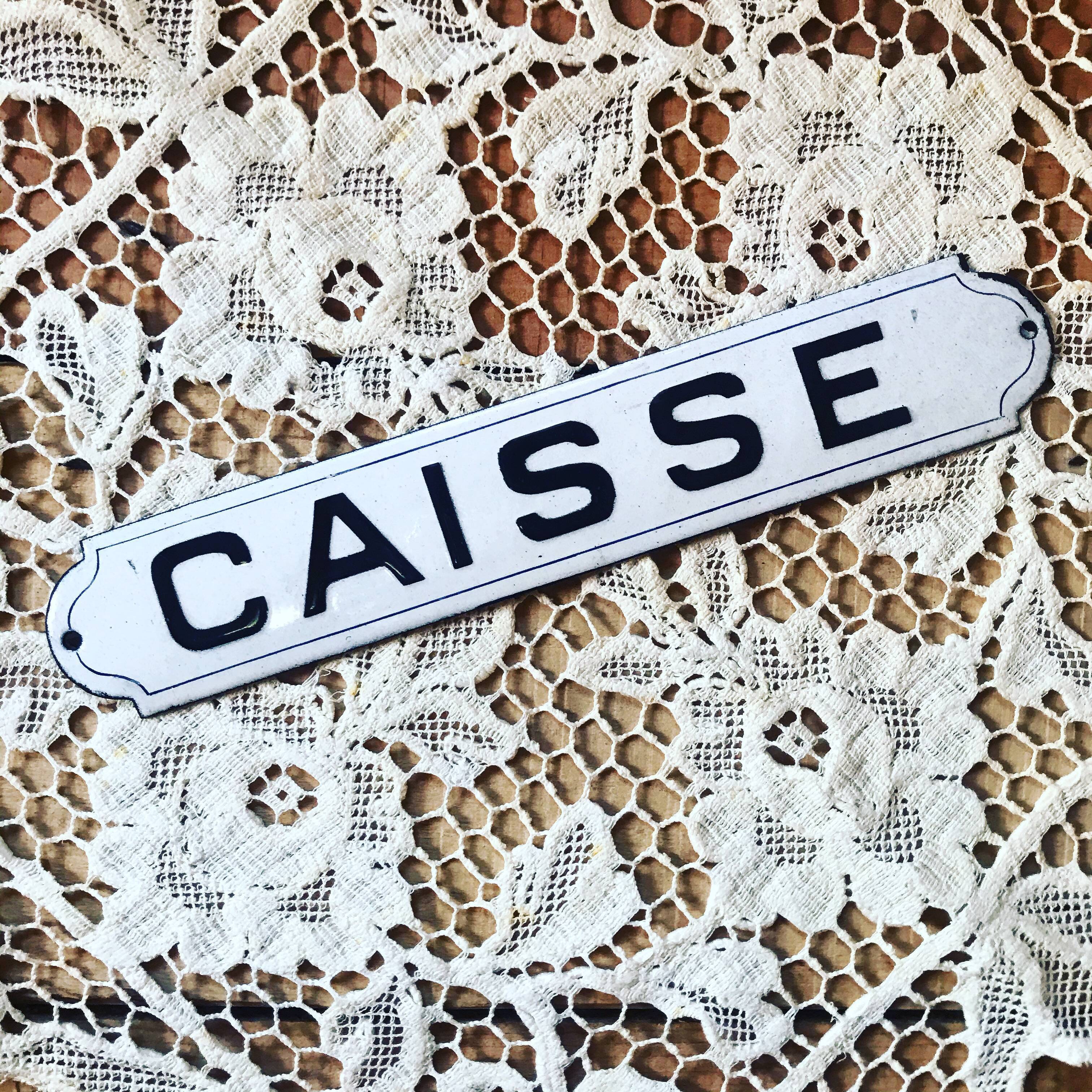 "caisse" enamelled trade plate.