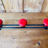 Wall coat rack in vintage red metal.