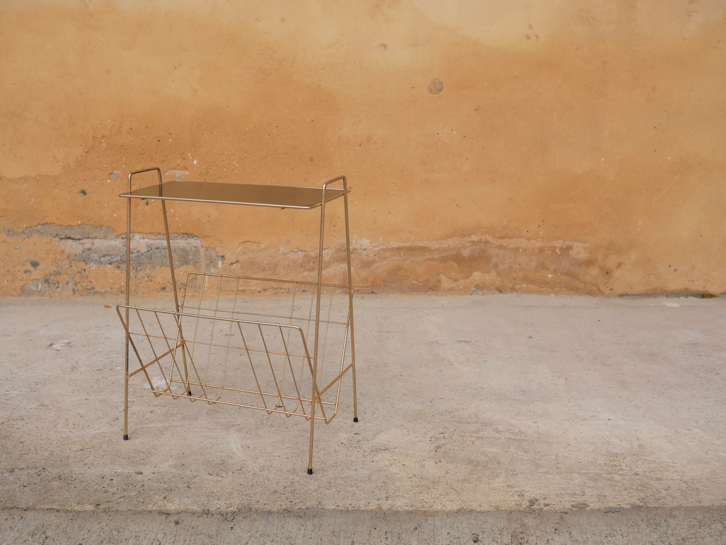 Vintage gold metal magazine rack