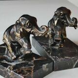 Art Deco Elephant Bookends. In regula on a black veined marble base. Rare model