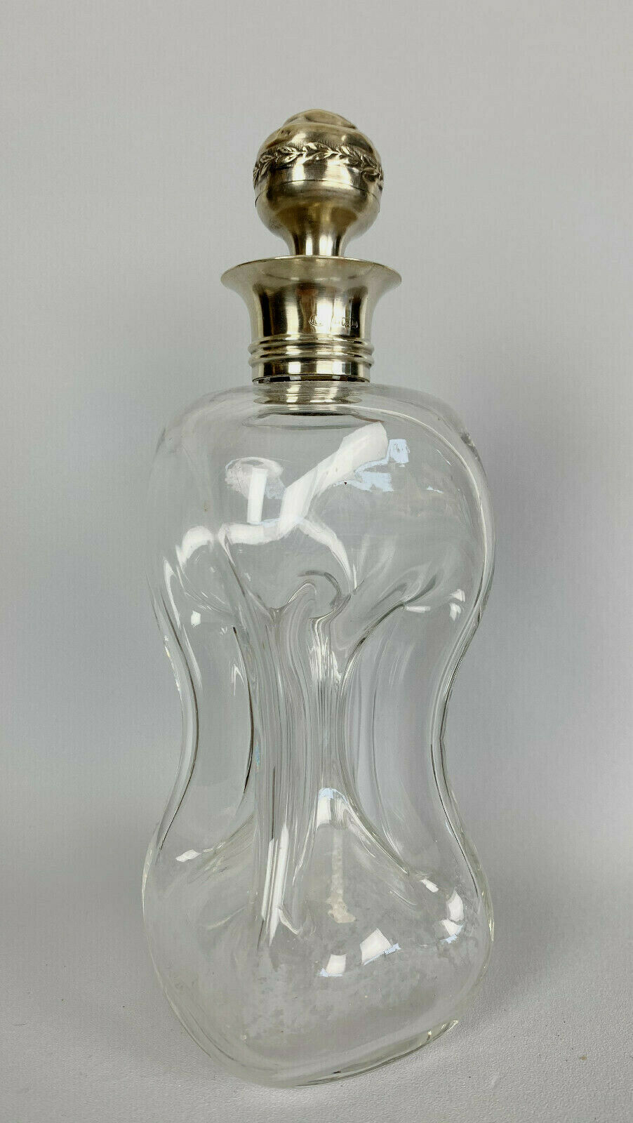 Blown glass carafe with silver frame and cap