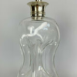 Blown glass carafe with silver frame and cap