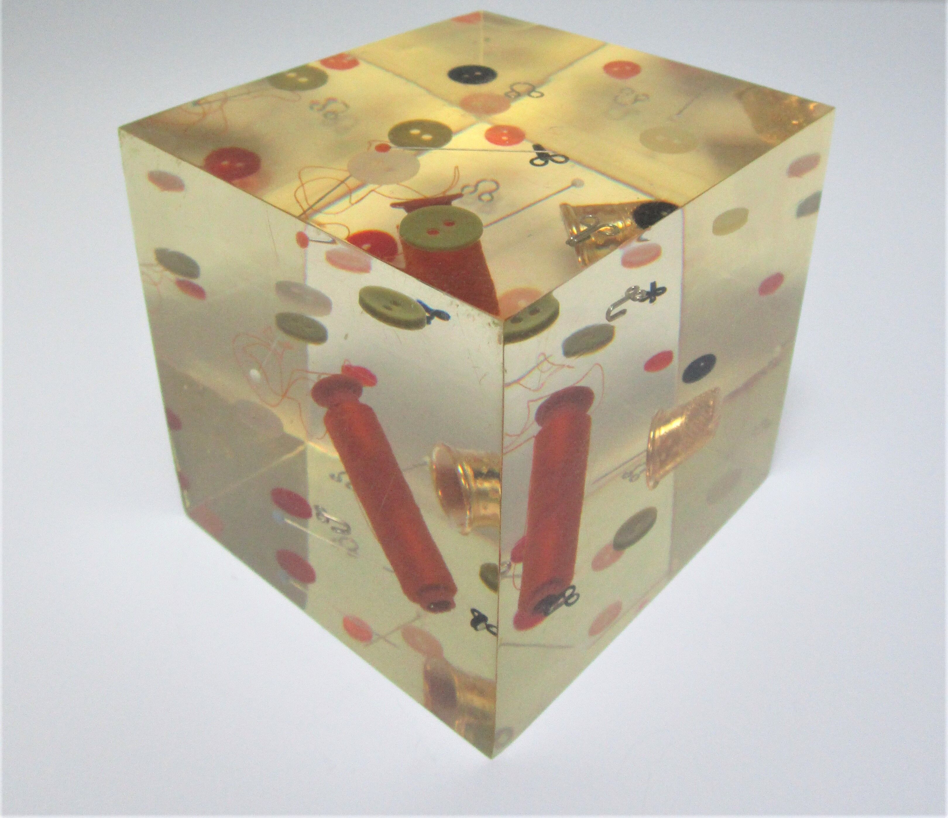 Paperweight sculpture block resin inclusions sewing design 70s