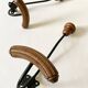 Pair of antique wooden and metal coat hooks