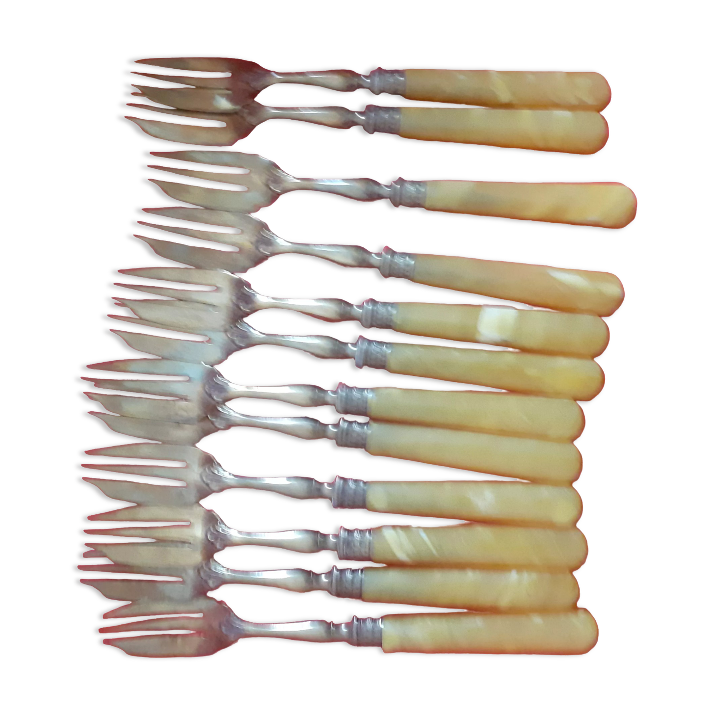 12 Cake forks. Around 1930. Golden metal and yellow Bakelite handle.
