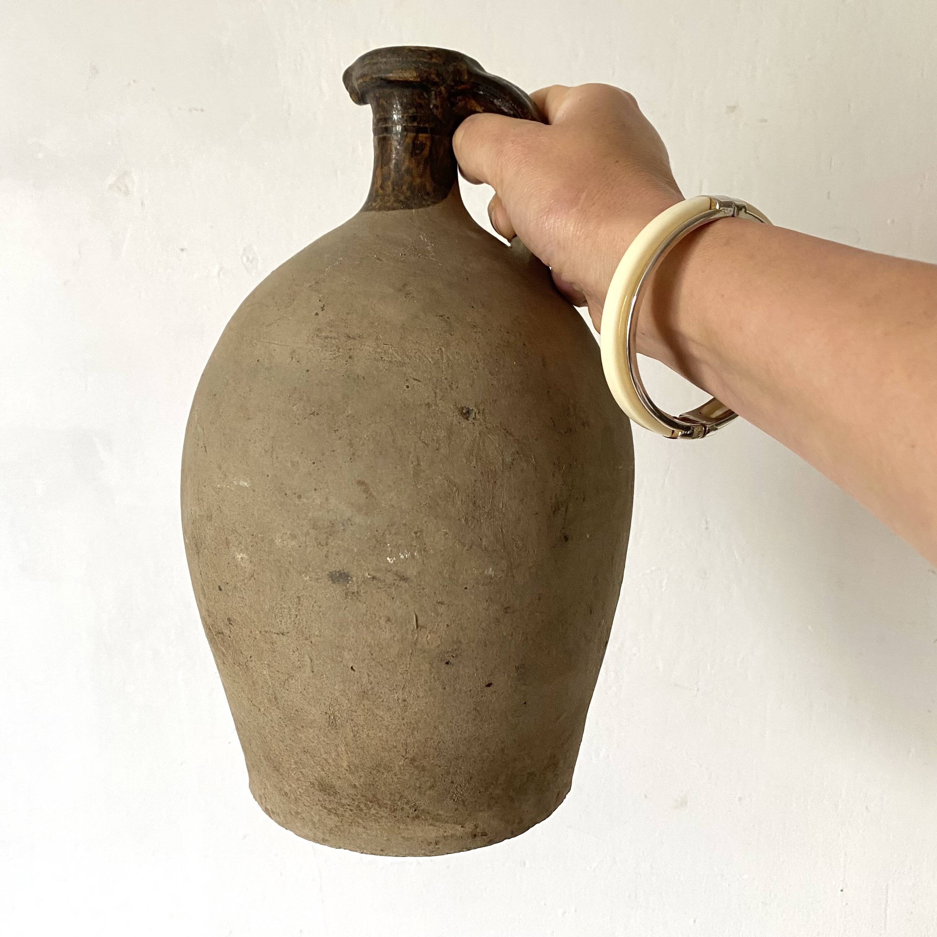 Antique jug, terracotta jar