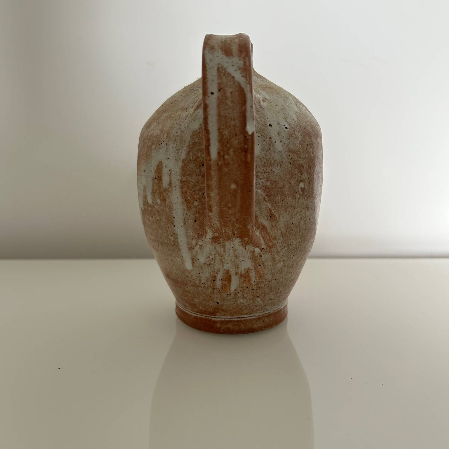 Patinated stoneware jug