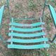 Pair of mid century distressed painted iron garden chairs