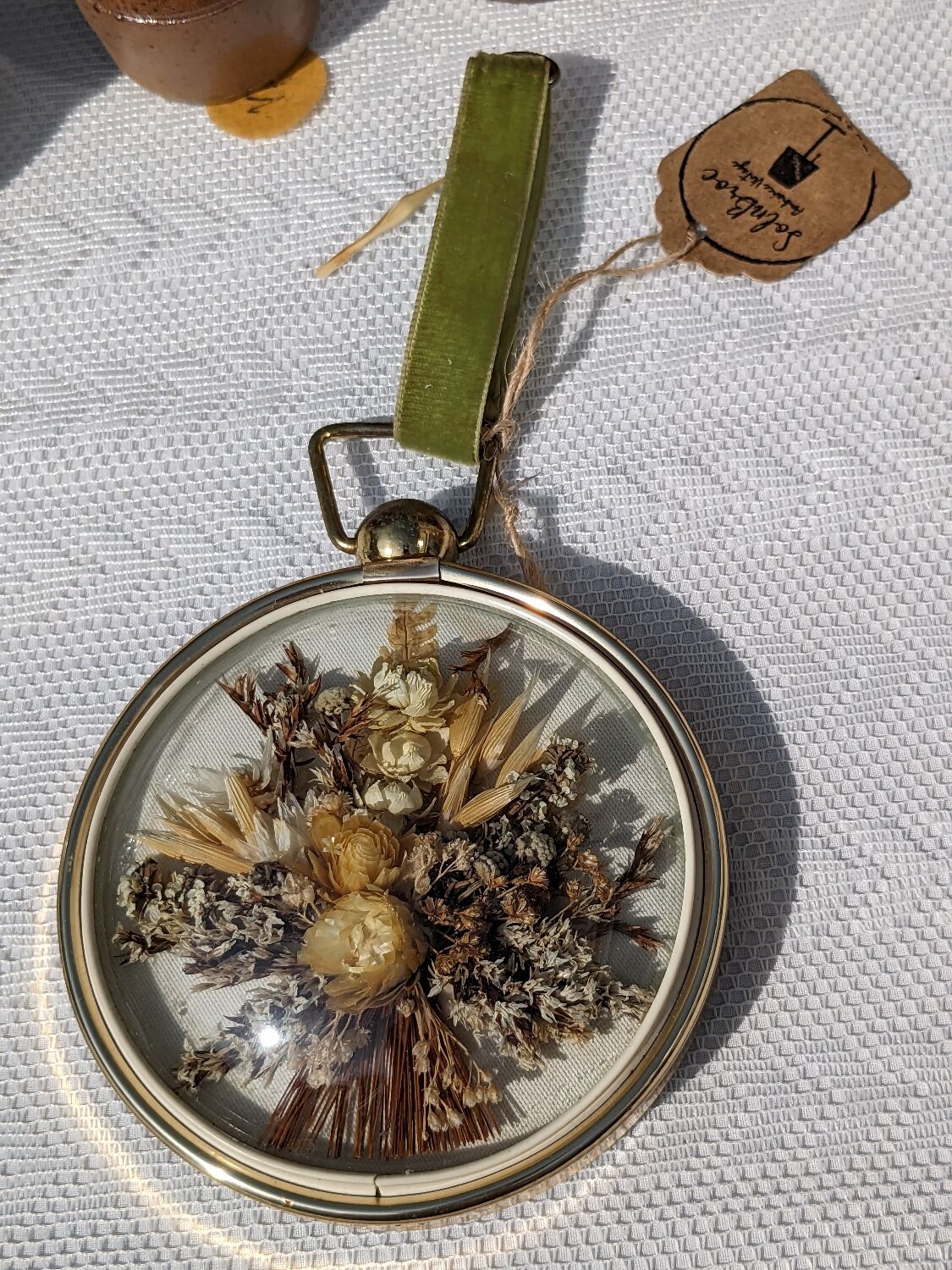 Domed frame of dried flowers