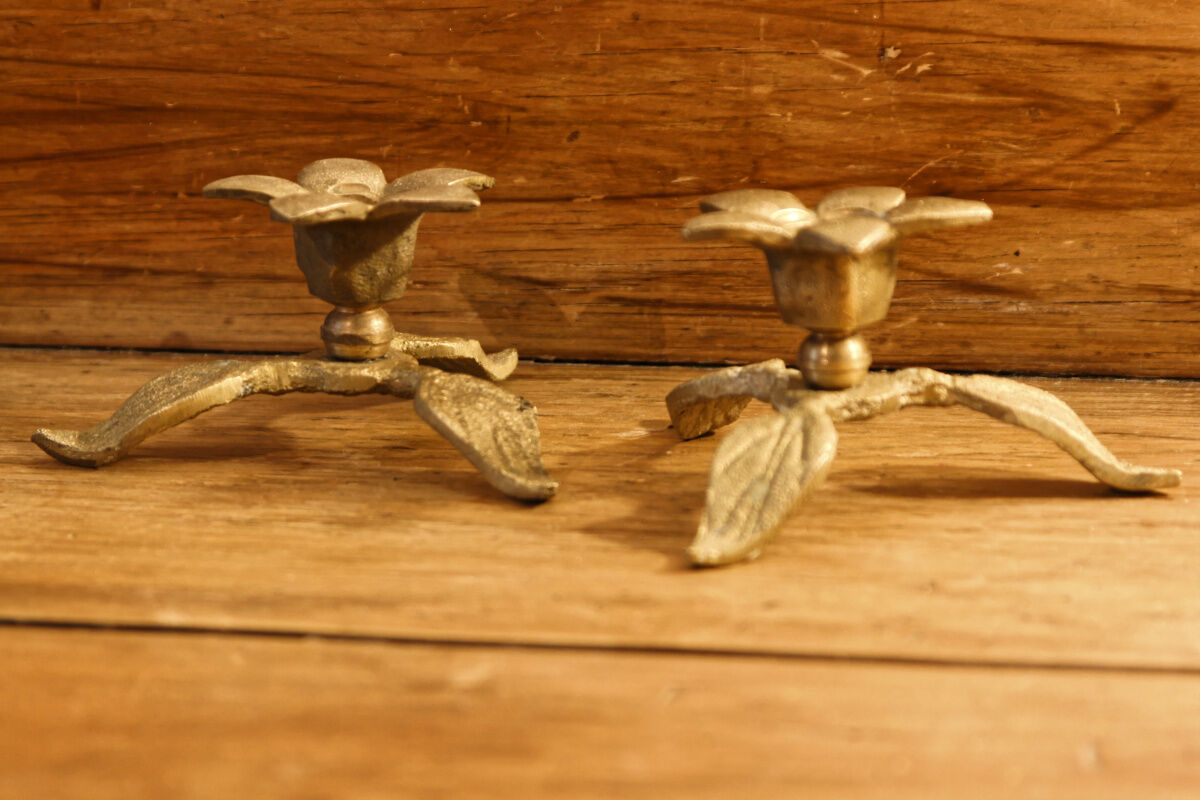 Pair of brass candle holders, flowers