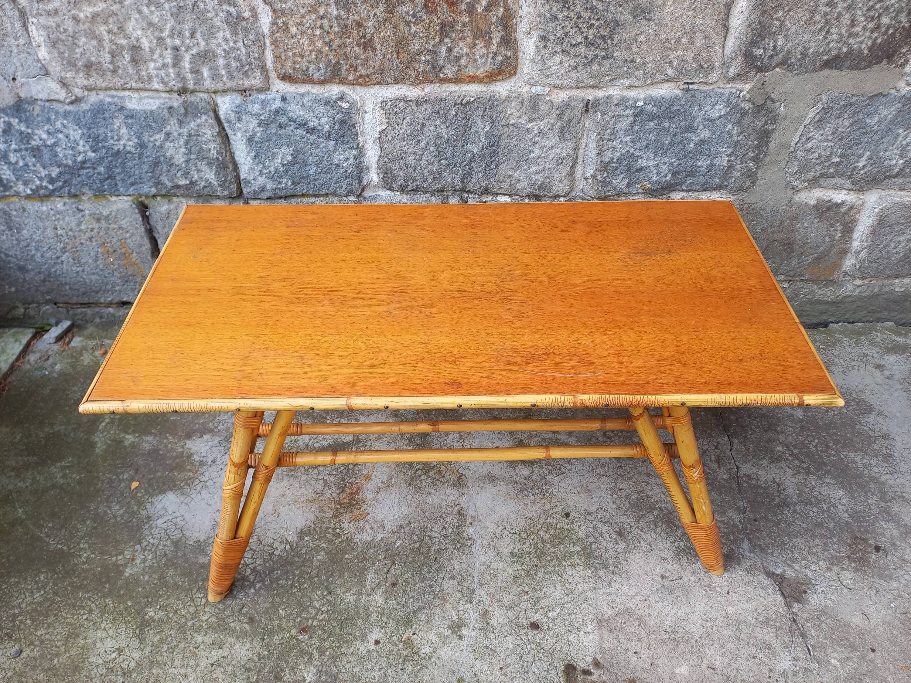 Rattan coffee table with compass legs