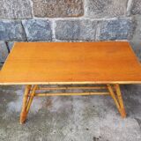 Rattan coffee table with compass legs