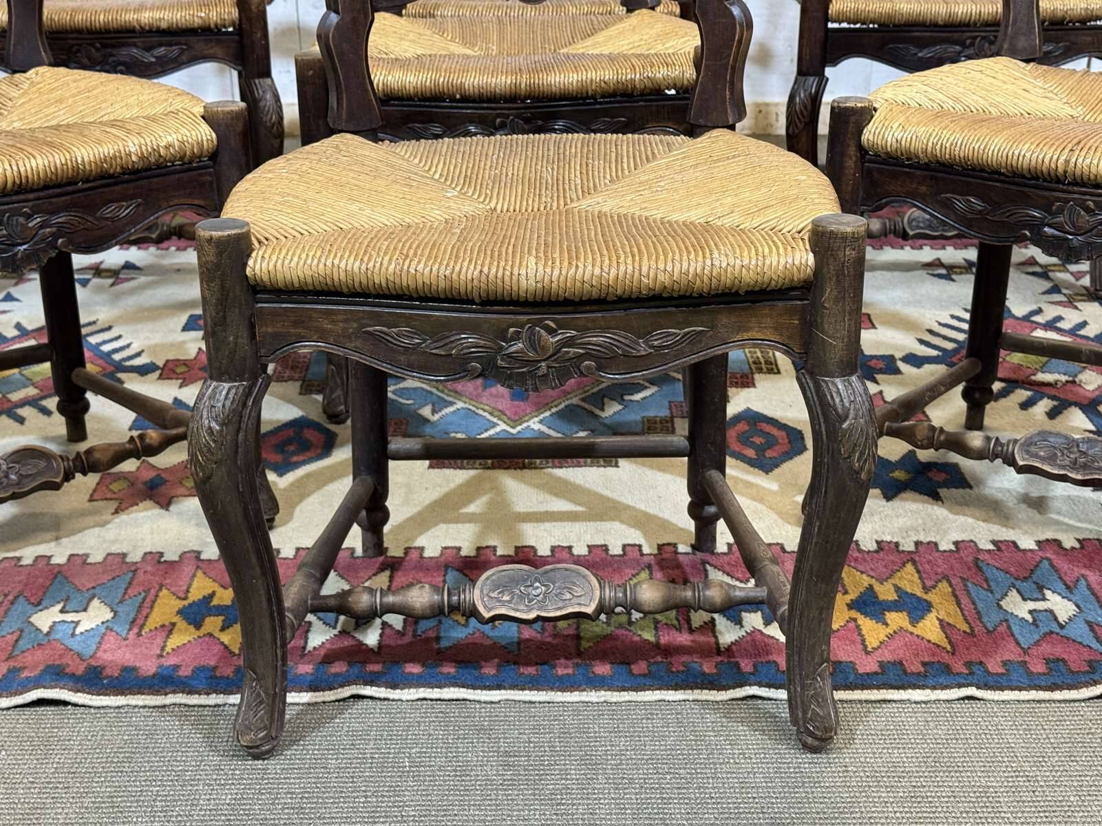 Set of 7 Louis XV style beech chairs with straw seats.