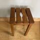 Wooden stool with central grip, quadripod base, 20th century