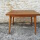 Oak table has two vintage extensions