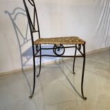 Wrought iron chair with woven seat