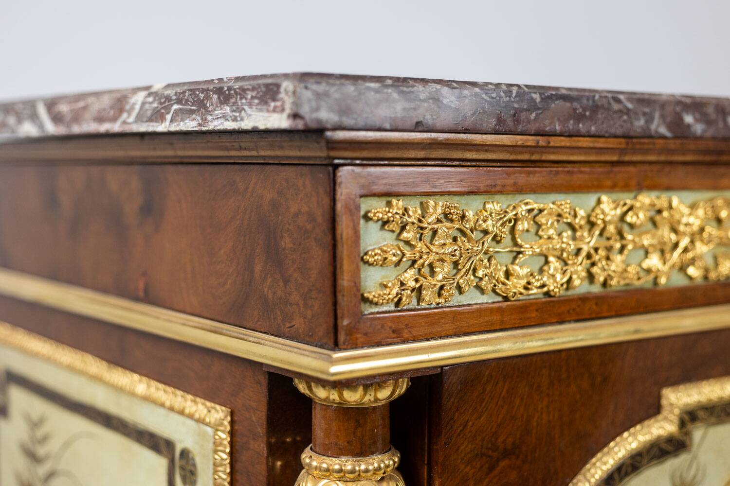 Empire style chest of drawers in lacquer, bronze and marble. Nineteenth century.