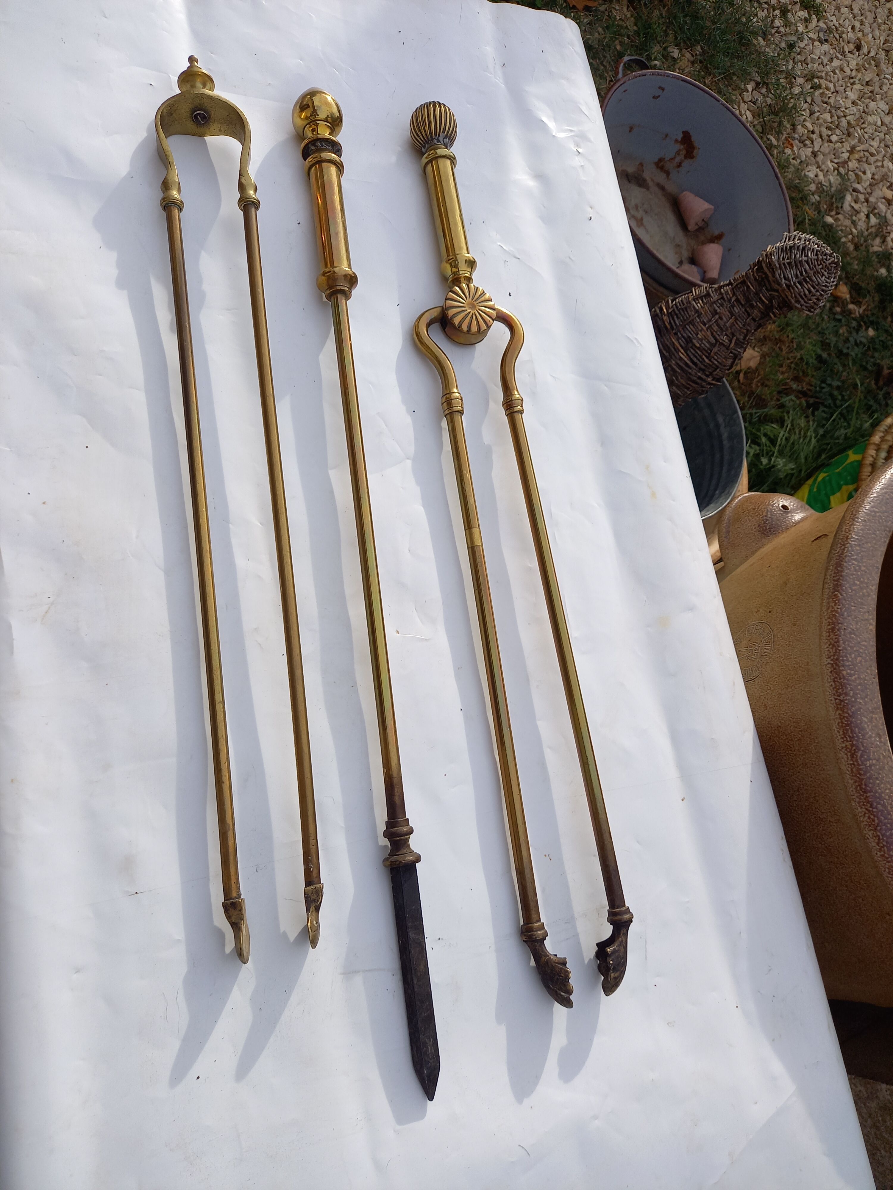 Mismatched set of chimney accessories two pliers and a fire pier