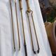 Mismatched set of chimney accessories two pliers and a fire pier
