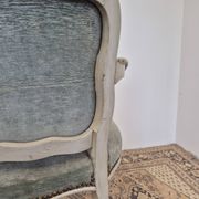 Louis XV style cabriolet armchair in patinated wood and velvet