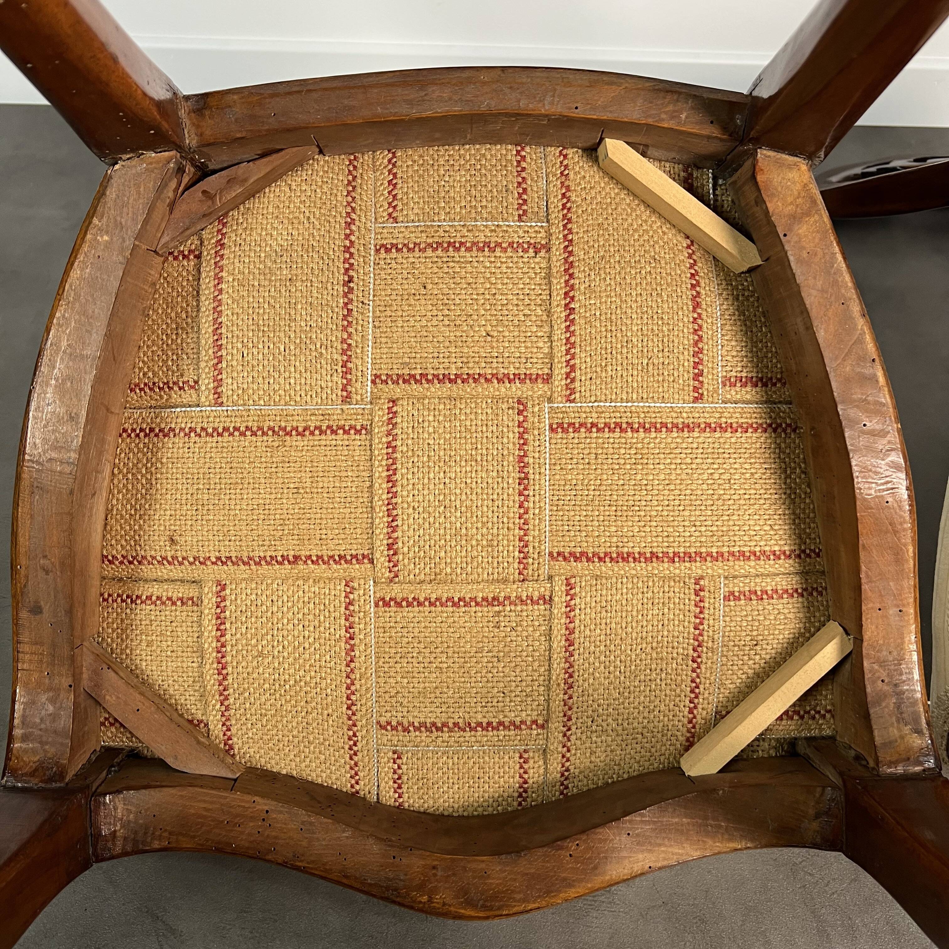 Pair of Victorian English chairs known as balloon chairs in solid mahogany.