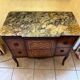 Small piece of furniture with marble top