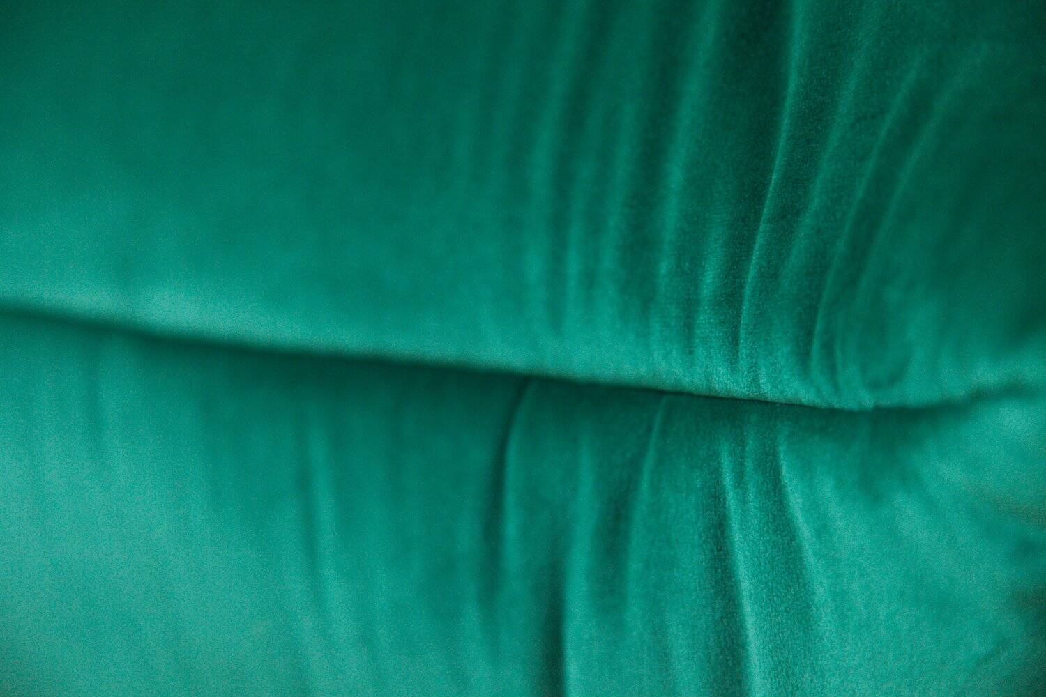 Togo lounge chair in bottle green velvet by Michel Ducaroy for Ligne Roset