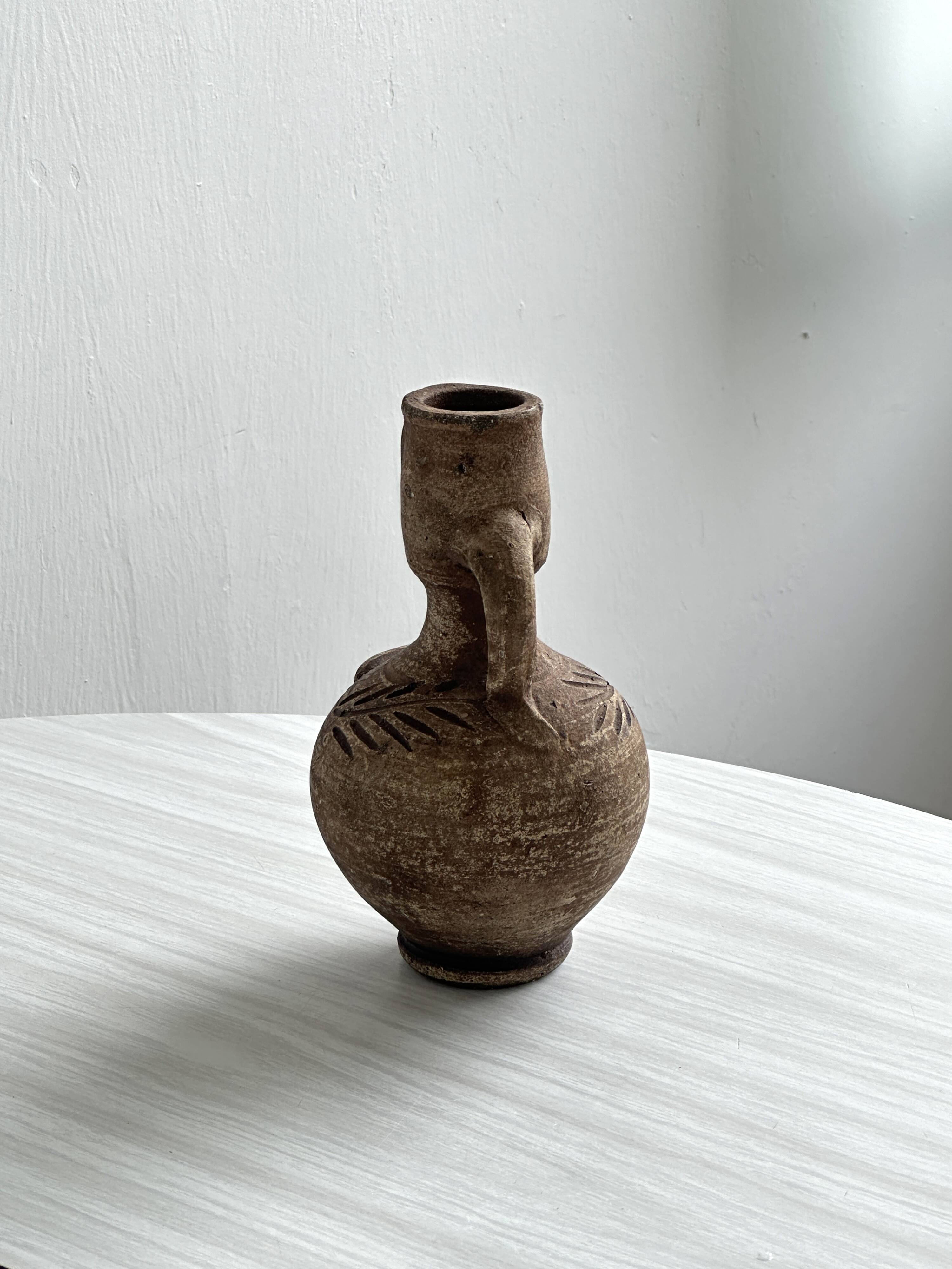 Ceramic woman face vase pitcher.