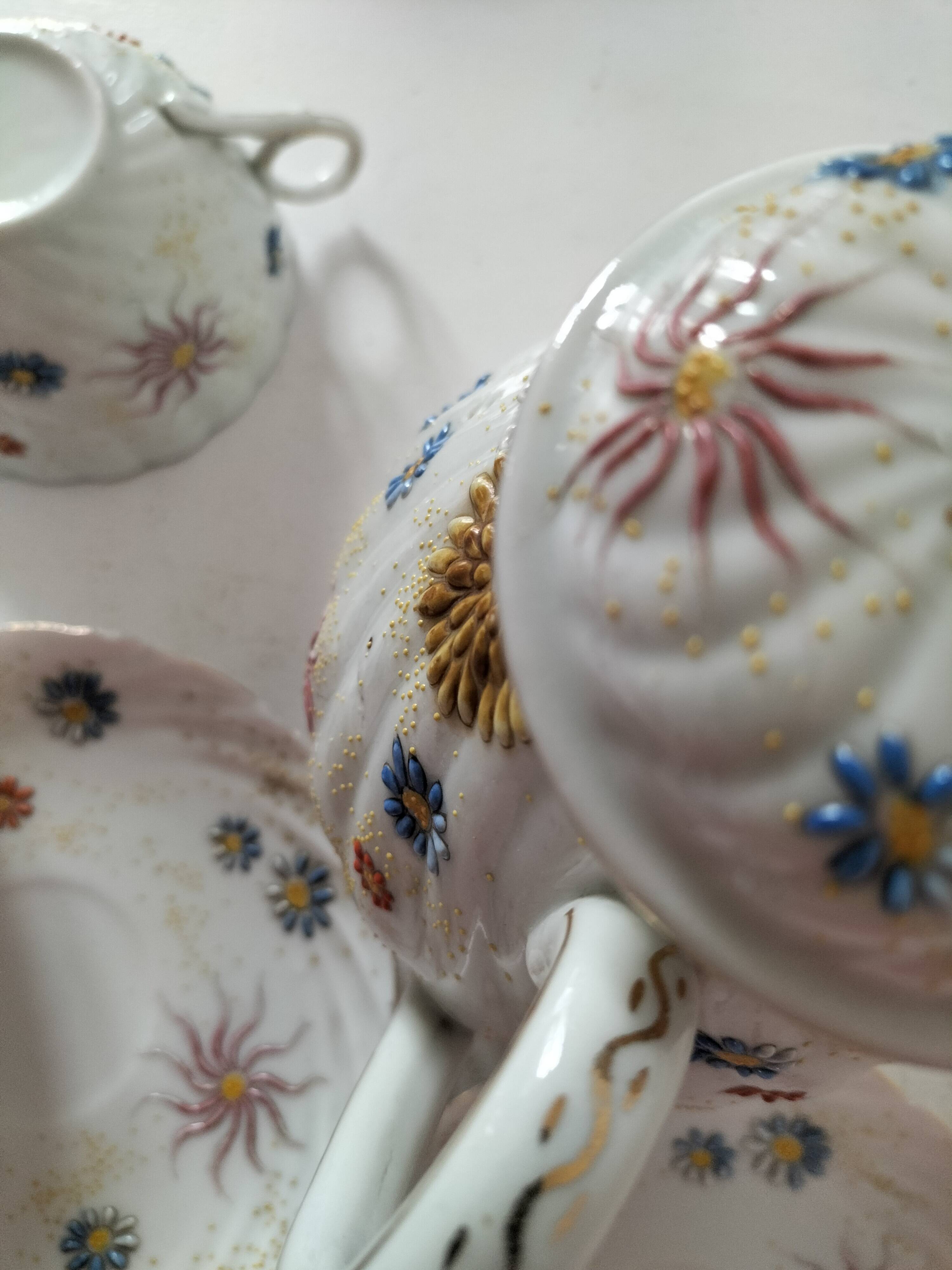 coffee pot, cup and saucers