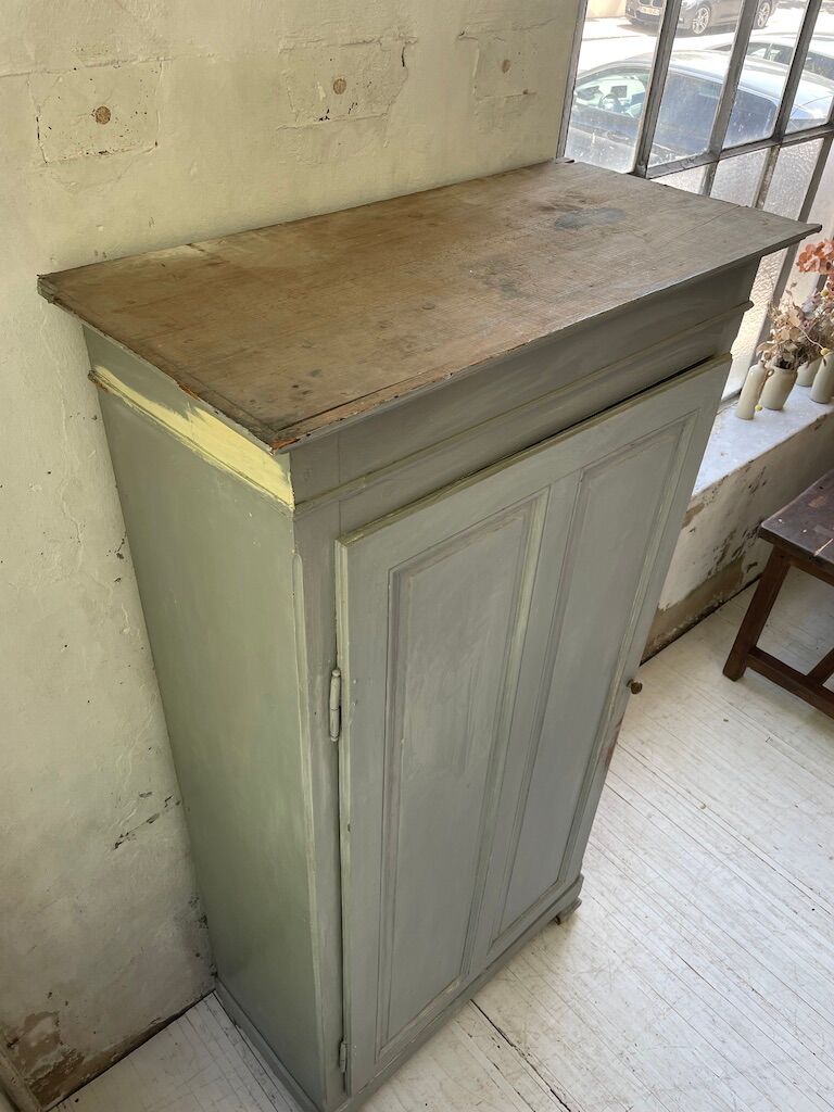 Blue patinated cap cabinet
