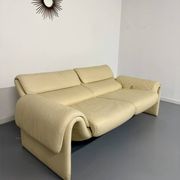 Two-seater designer sofa De Sede DS-2011 in cream leather with adjustable backrest.
