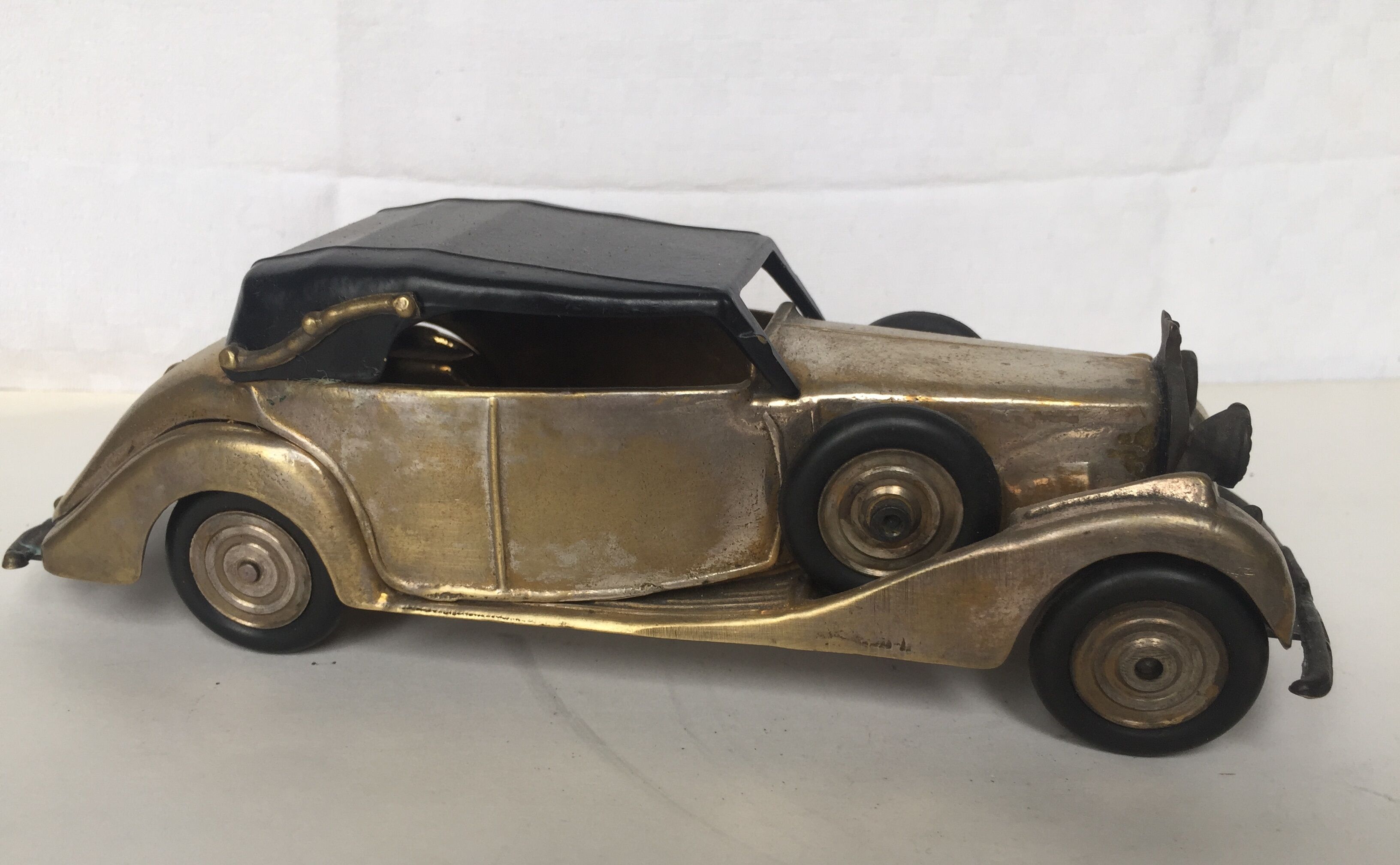 Ancient miniature metal car