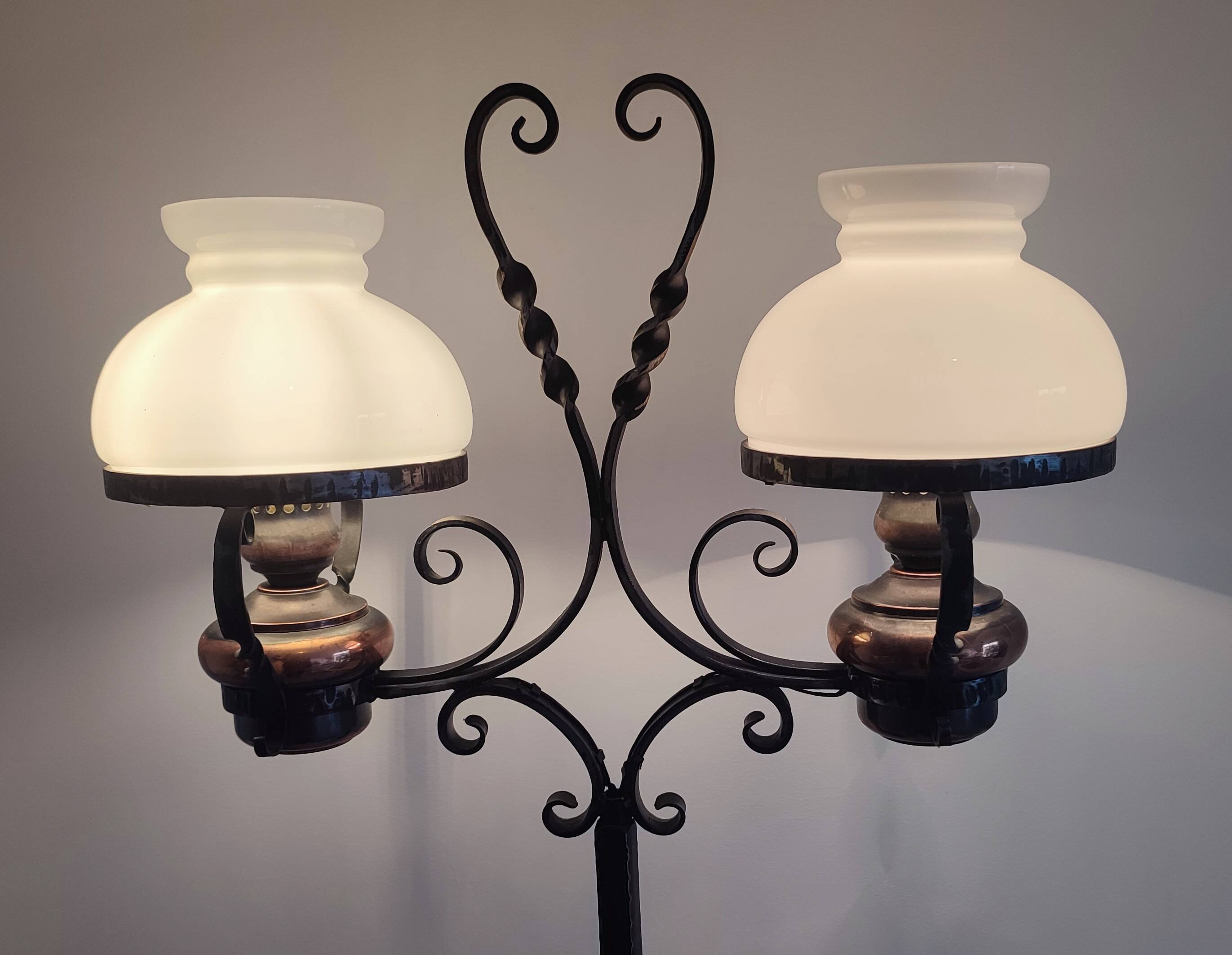 Antique double globe opaline floor lamp, wrought iron, rustic vintage style.