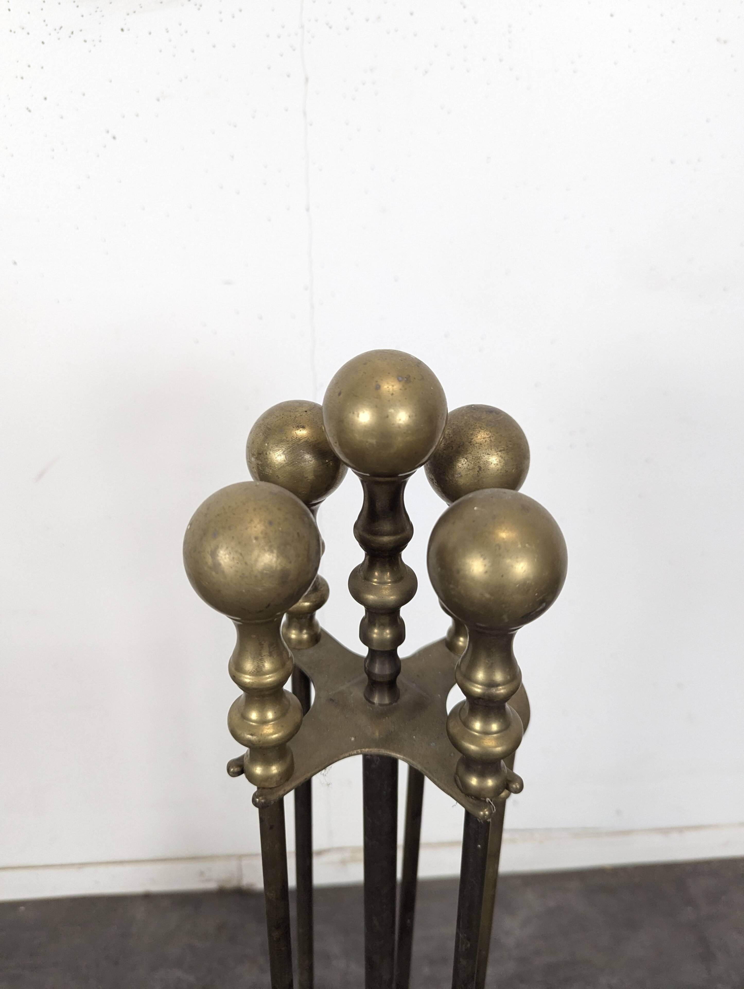 Brass fireplace tool set with four accessories
