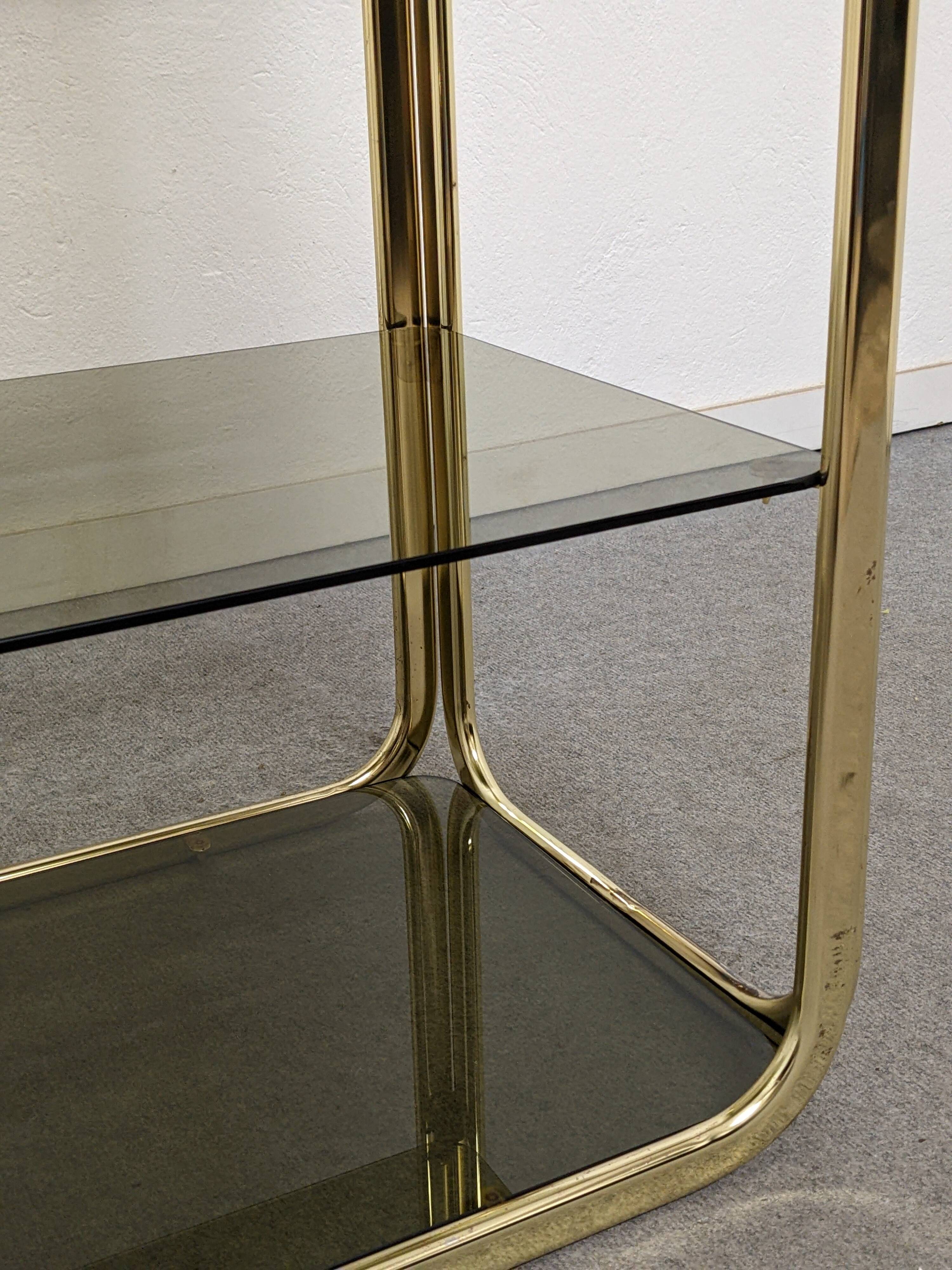 Hollywood Regency gilt metal and smoked glass shelf, Italy circa 1970