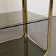 Hollywood Regency gilt metal and smoked glass shelf, Italy circa 1970