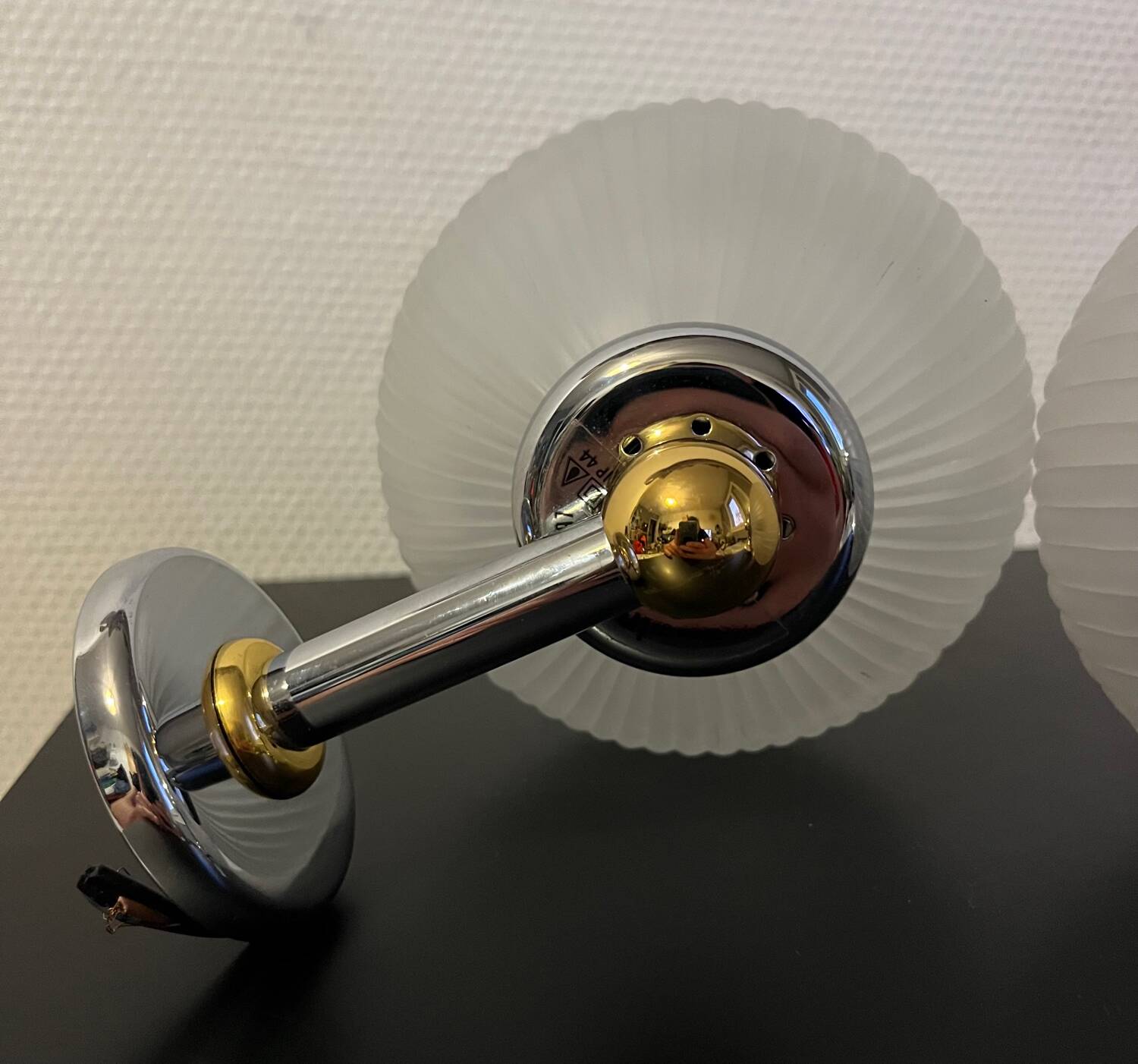 Pair of Inda metal and chiseled glass wall lights