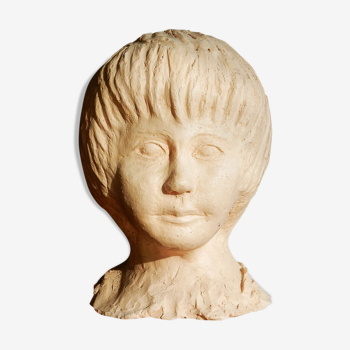 Child bust in modeled white clay
