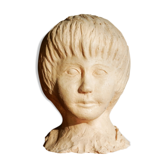 Child bust in modeled white clay