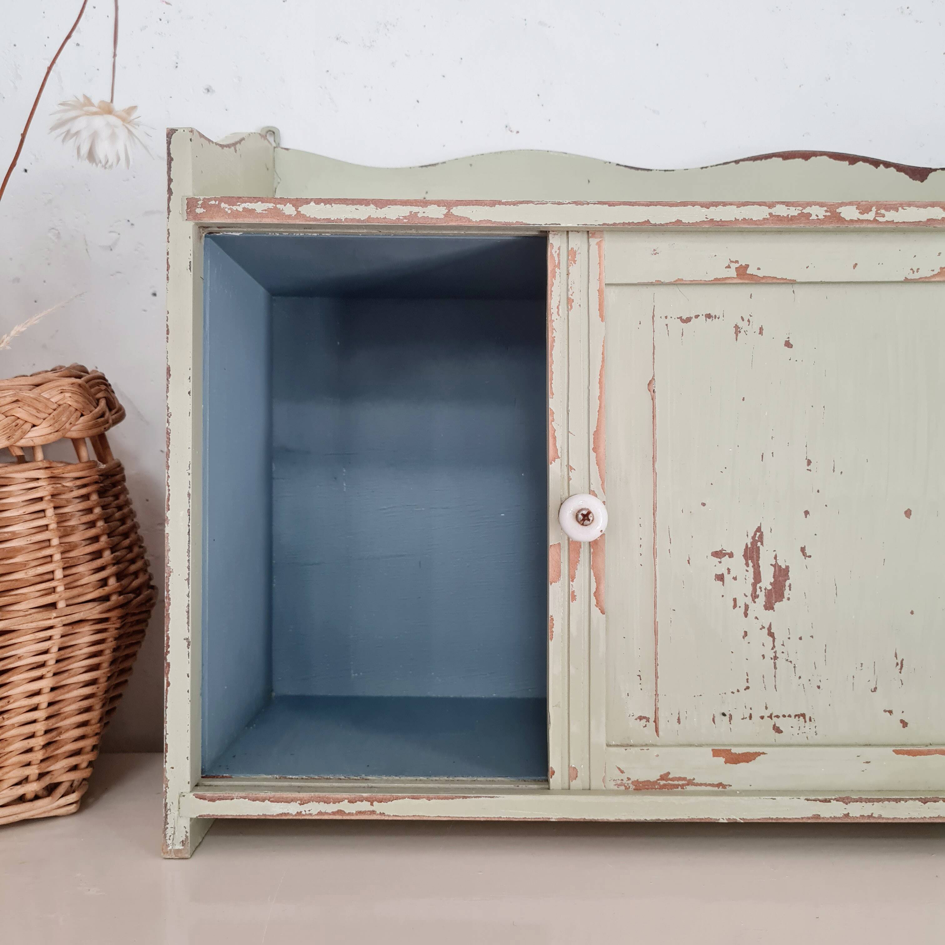 Small old wall shelf with sliding doors