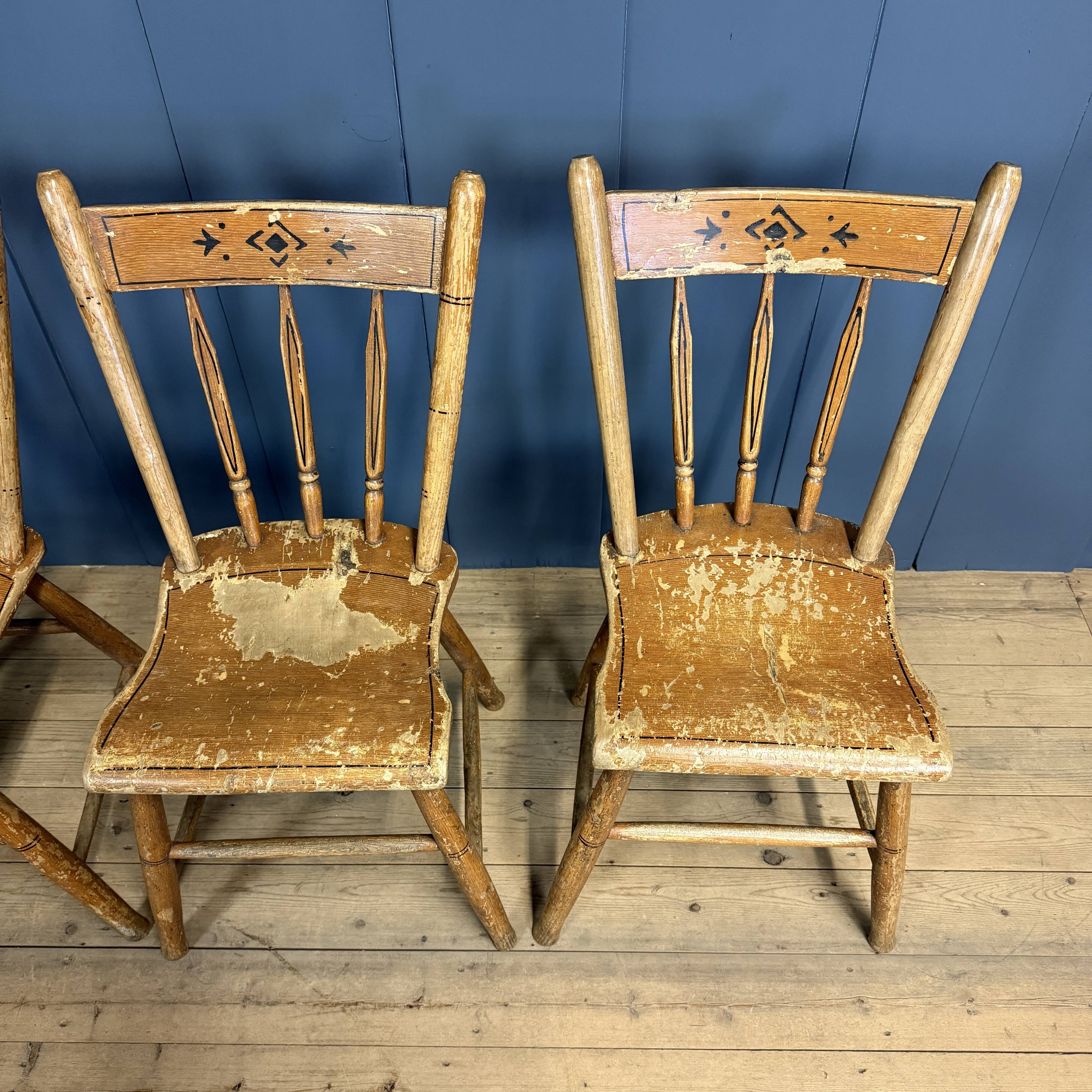Set of four painted Dutch kitchen chairs.