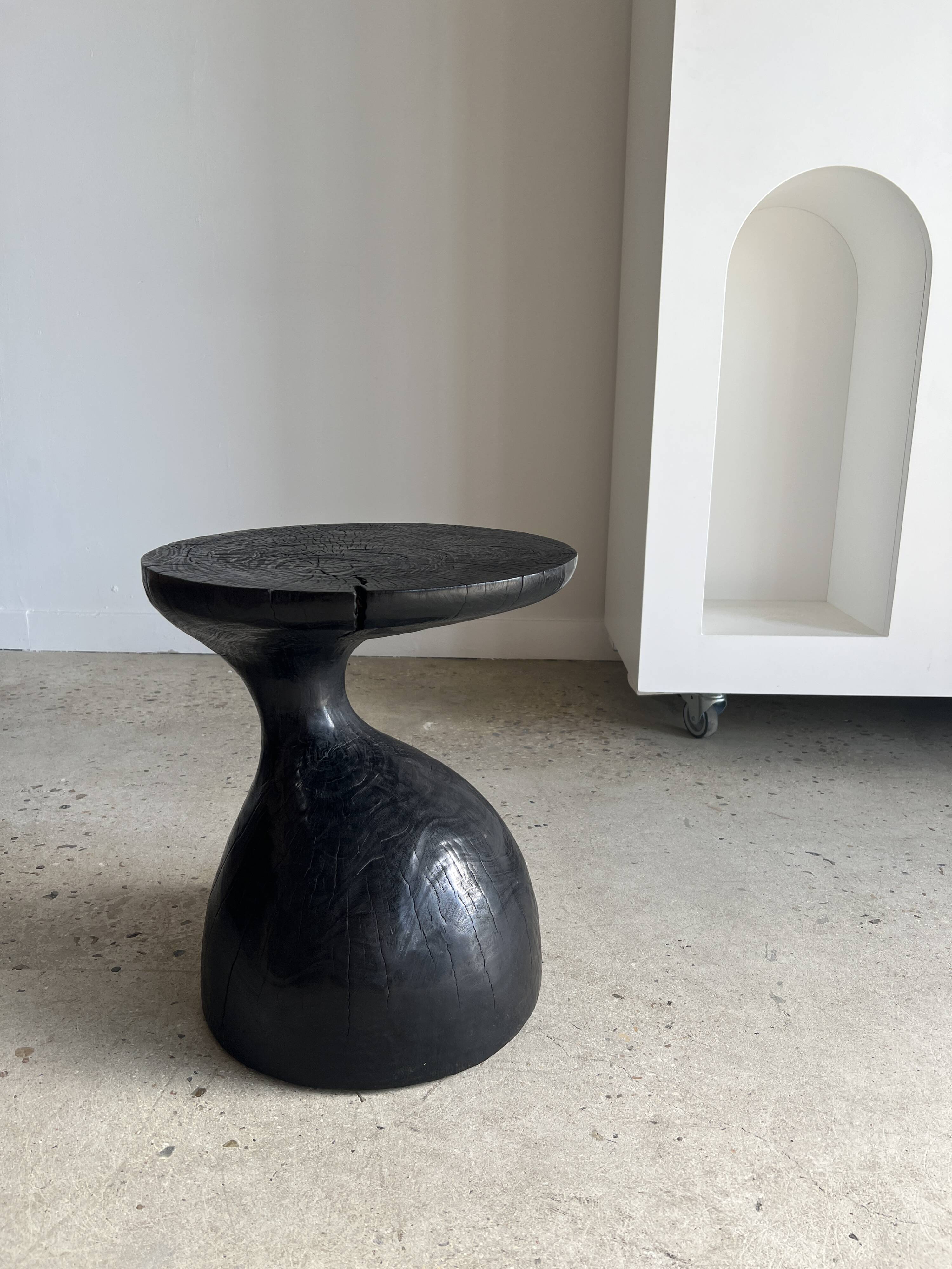 Solid wood (monoxyl) side table, organic shape, black color