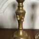 Pair of brass candlesticks with tassels