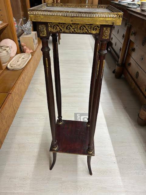 Wooden and brass saddle