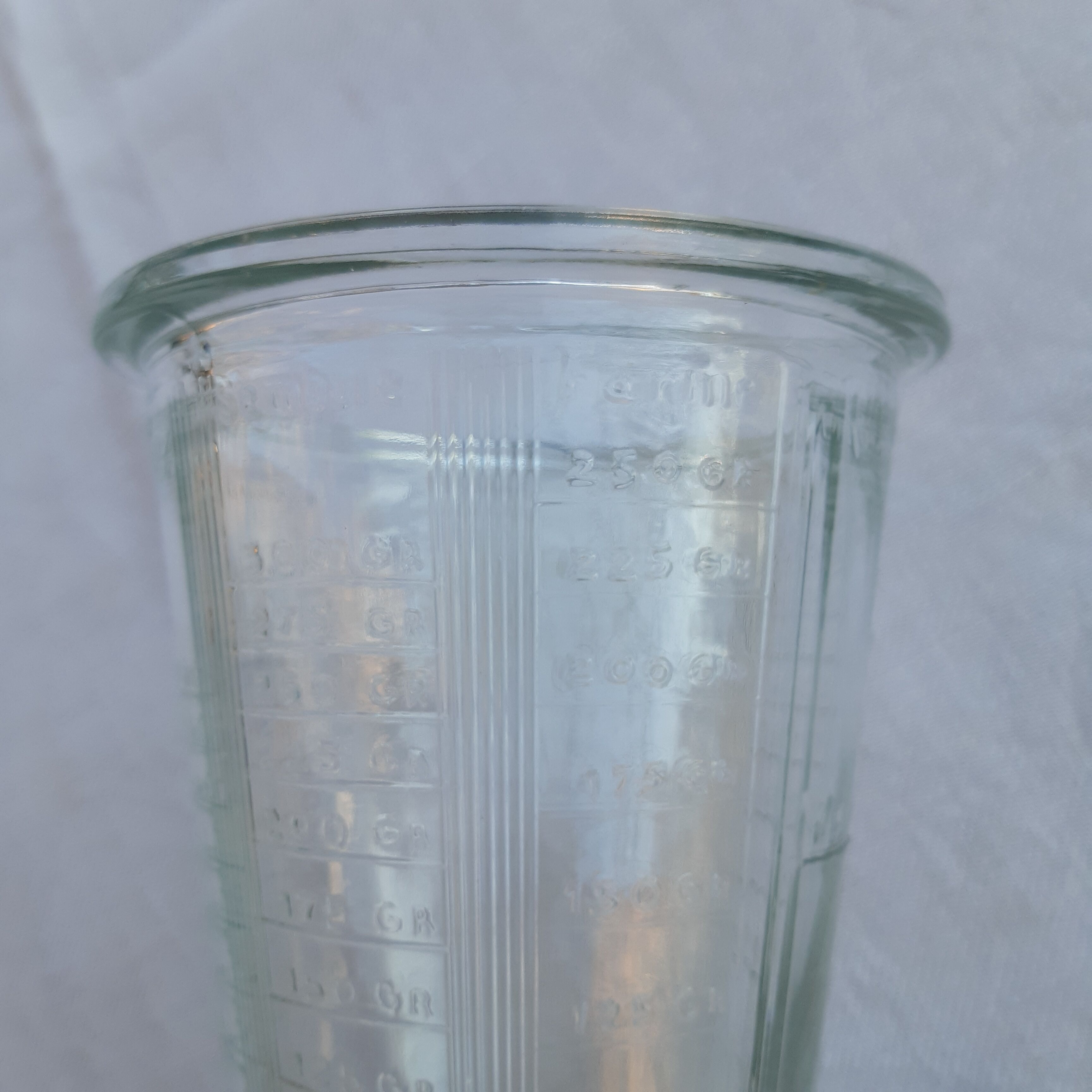 Graduated glass for weighing in the kitchen